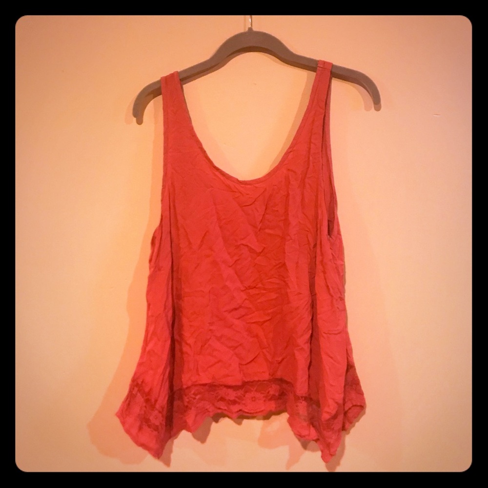 Salmon colored lacy tank top.